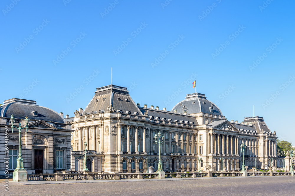 Three-quarter view of the facade of the Royal Palace of Brussels, the official palace of the King and Queen of the Belgians in the historic center of Brussels, Belgium, on a sunny morning.