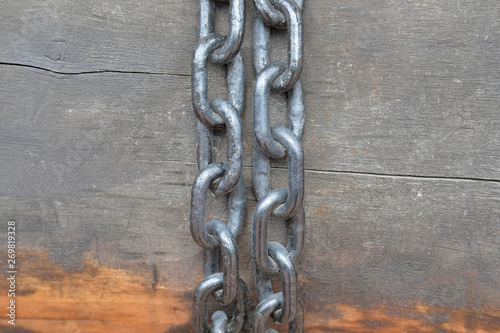 rusty chain on wooden background