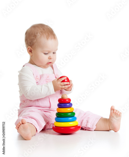 Nursery baby playing with p...