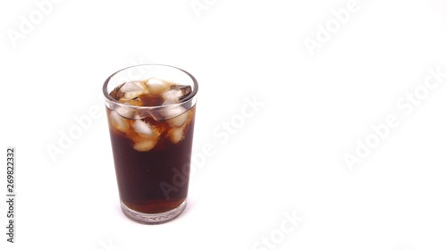 Cola drink in glass with ice