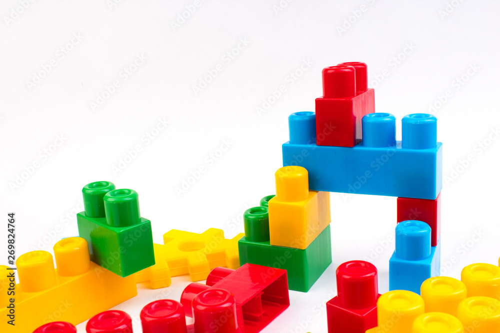 Lot of colorful rainbow toy bricks background. Educational toy for children Isolated on white background. 3D Rendering. Top view with copy space. Lot of colorful rainbow toy bricks background. Educational toy for children Isolated on white background. 3D Rendering. Top view with copy space.