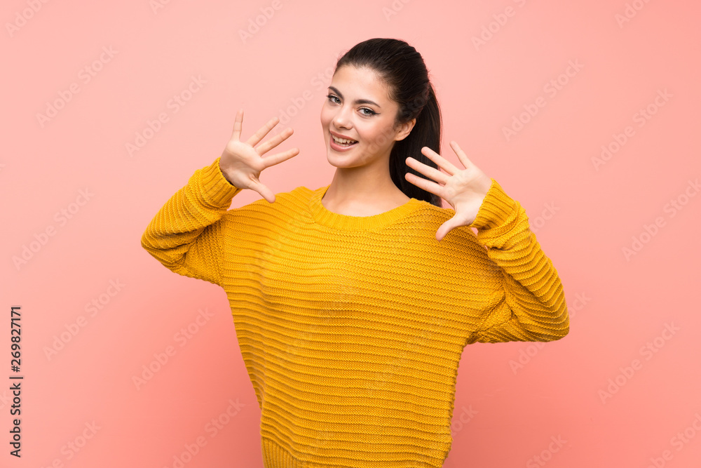 Teenager girl over isolated pink wall counting ten with fingers Teenager girl over isolated pink wall counting ten with fingers