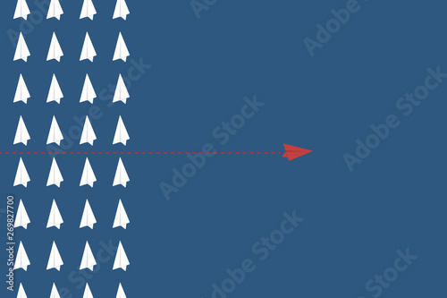 Think differently concept. Be different. Red airplane changing direction. New idea, change, trend, courage, creative solution, innovation and unique way concept.