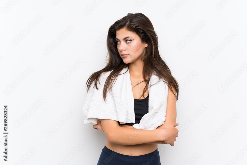 Teenager sport girl over isolated white background standing and thinking an idea Teenager sport girl over isolated white background standing and thinking an idea