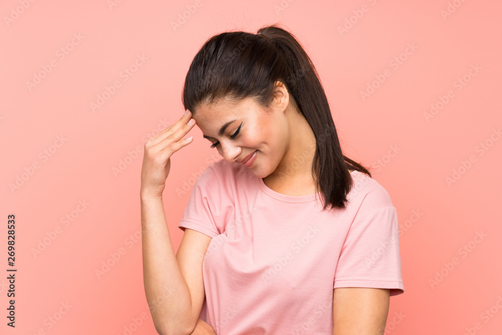 Teenager girl over isolated pink background laughing Teenager girl over isolated pink background laughing