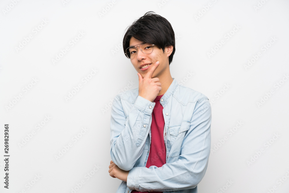 Asian man on isolated white background with glasses and smiling Asian man on isolated white background with glasses and smiling