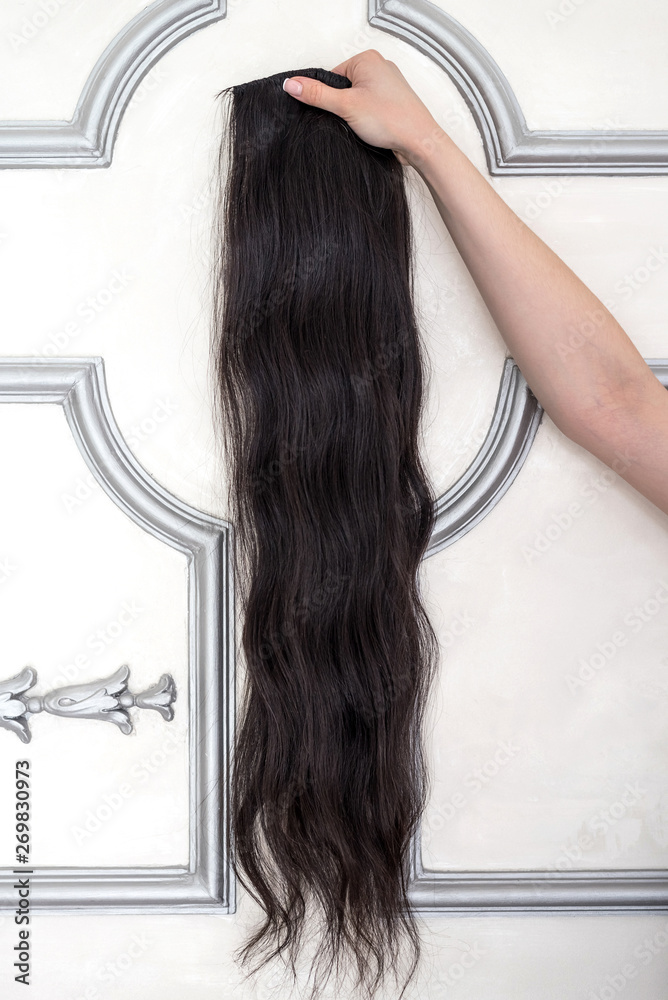 Naklejka premium Sample of dark brown hair extension