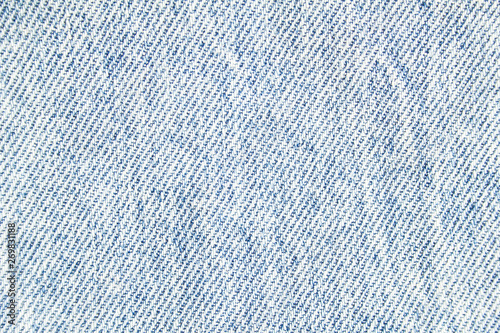 Closeup light blue jeans denim fabric texture background. Stock