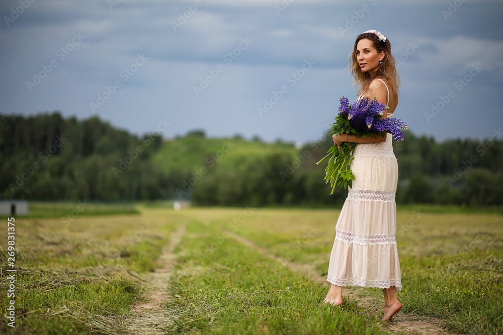 Girl with a bouquet of blue flowers Girl with a bouquet of blue flowers