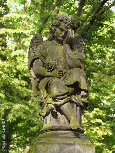 Statue of small angel on a desert grave  Olsany cemetary  Prague  Czech republic
