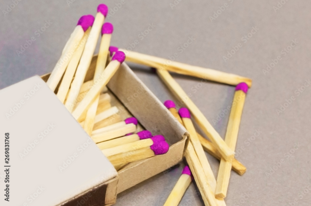 Wooden matches in a box scattered close-up