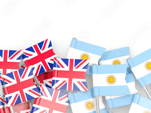 Pins with flags of UK and argentina isolated on white.