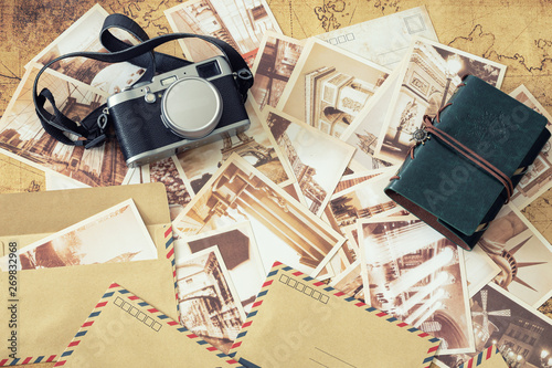Holiday memories. Old postcards with a map, photo camera and travel notebook