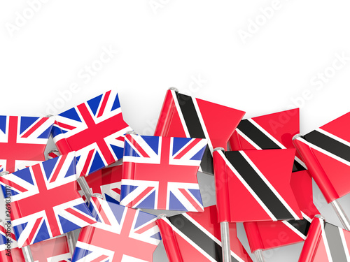 Pins with flags of UK and trinidad and tobago isolated on white.