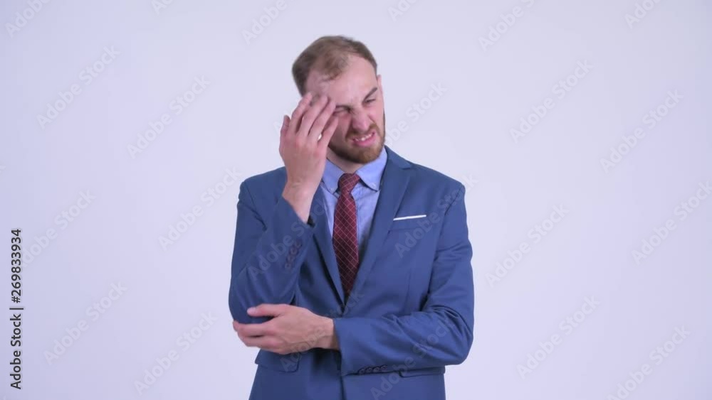 Stressed bearded businessman getting bad news Stressed bearded businessman getting bad news