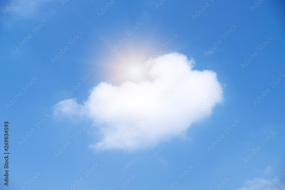 Beautiful white clouds with sun on blue sky.Color shade gradient from white to blue for background wallpaper.