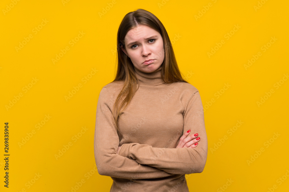 Obraz premium Young woman over colorful background sad