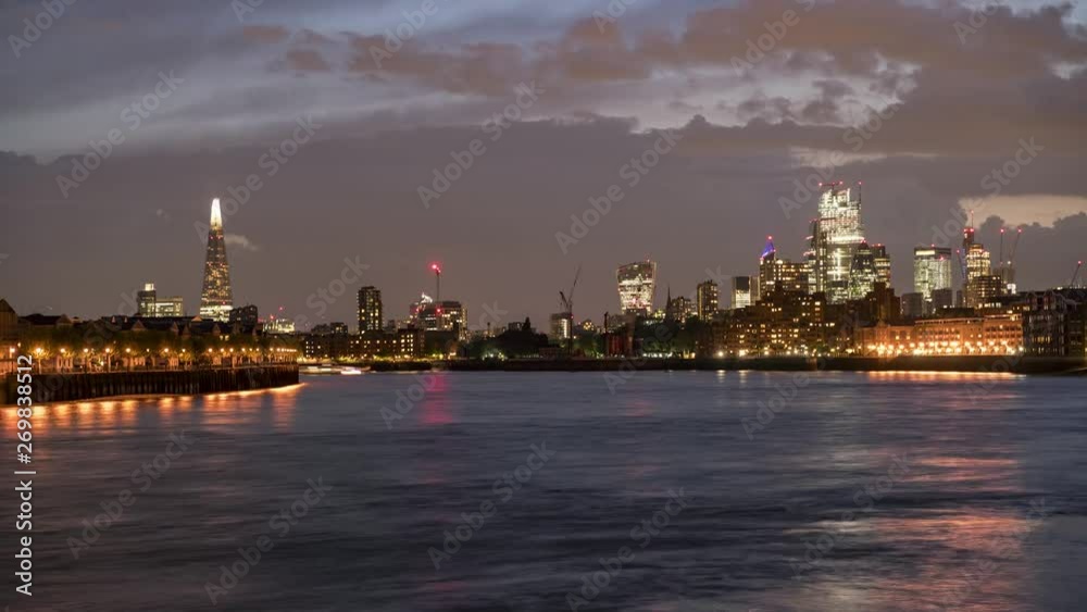 Night time lapse view over the skyline of London, UK, featuring the illuminated skyscrapers of the City Night time lapse view over the skyline of London, UK, featuring the illuminated skyscrapers of the City