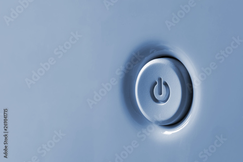 Power button close up. Standby-button in a blue-gray.