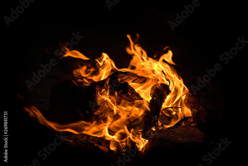 fire flames with sparks on a black background © Mad Madara