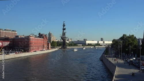tower of Tsar Peter the great in the middle of Moskva river in Moscow, with New Tretyakov Gallery in the background and people in the summer sunny day