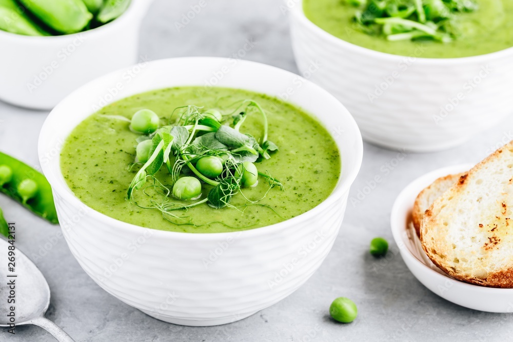 Summer cream soup with green fresh pea shoots Summer cream soup with green fresh pea shoots