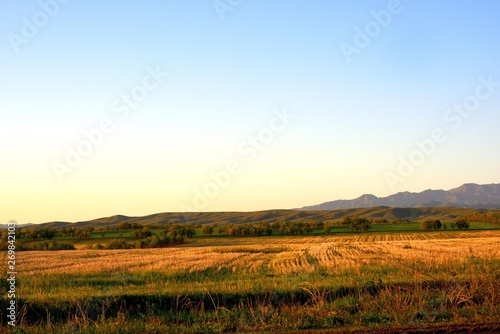 Rural area dawn landscape of fields and mountains near Saryozek  Almaty region