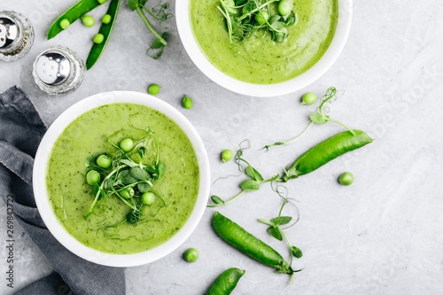 Summer cream soup with green fresh pea shoots