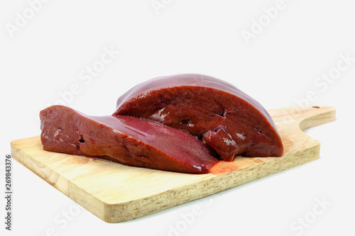 fresh raw liver slice in piece on chopping bord
