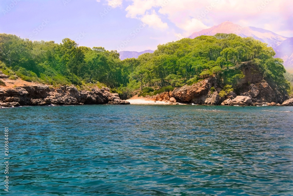 picturesque view of sea trees mountains and sky picturesque view of sea trees mountains and sky