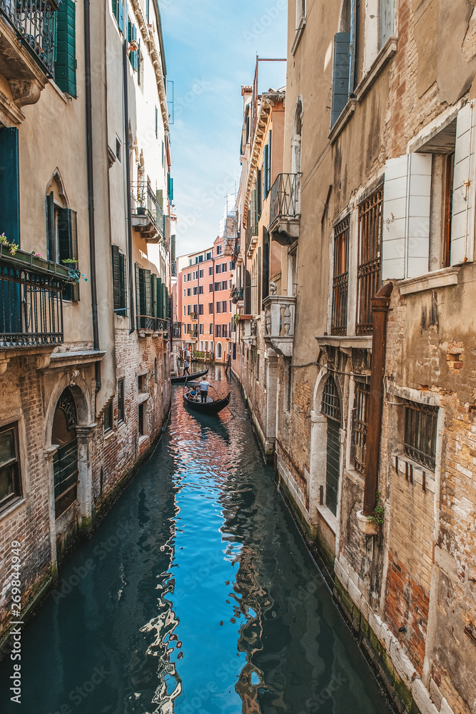 Venice, city of Italy. View of the canal, the Venetian landscape with boats and gondolas
