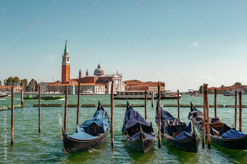 Venice, city of Italy. View of the canal, the Venetian landscape with boats and gondolas.