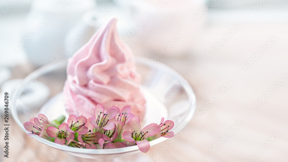 Delicate flowers Kalanchoe on the background Delicate pink apple marshmallow handmade in a glass transparent vase. Marshmallow, dessert. Copy space Delicate flowers Kalanchoe on the background Delicate pink apple marshmallow handmade in a glass transparent vase. Marshmallow, dessert. Copy space