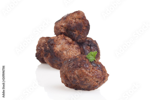 closeup homemade cooked meatball with parsley