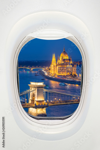 Budapest at night seen through the window of airplane, travel in Europe concept