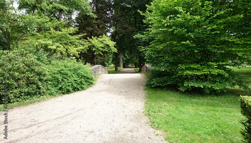 over a stone bridge in the park