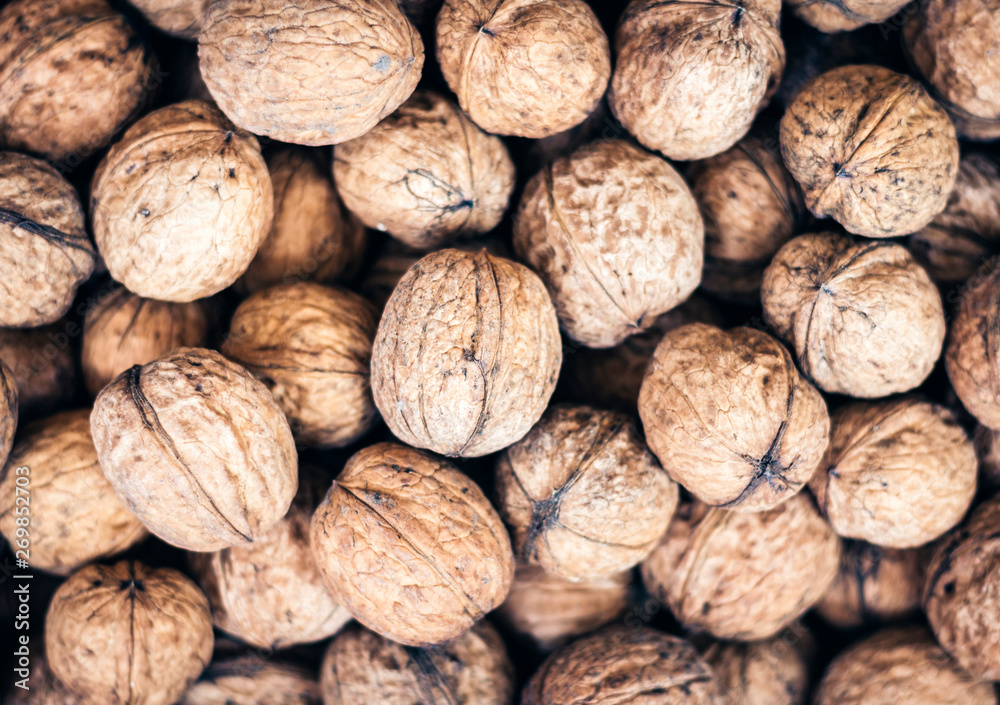 Natural walnut in shell background pattern texture. Natural walnut in shell background pattern texture.