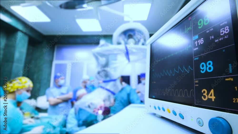 a group of surgeons operate on the patient's vital functions monitor close-up.Cinemagraph a group of surgeons operate on the patient's vital functions monitor close-up.Cinemagraph