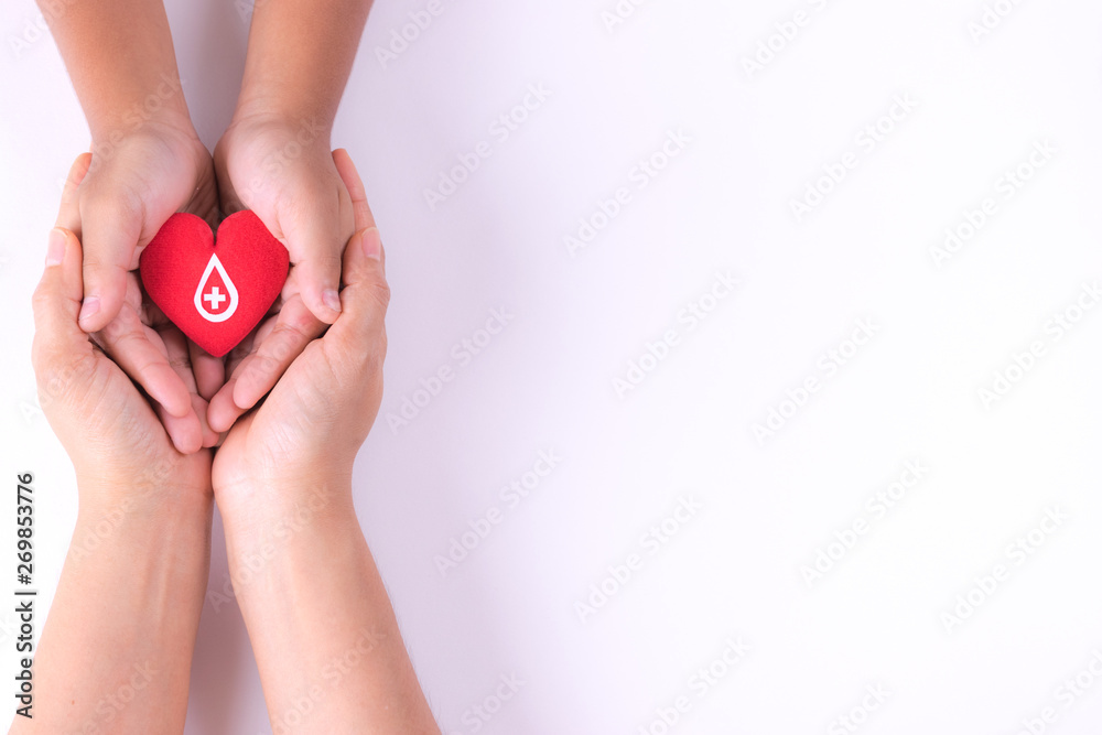 Woman and child hands holding red heart  for blood donation concept,World blood donor day, health care love, hope and family concept, world heart day,world health day. Copy space for advertisers. - obrazy, fototapety, plakaty 