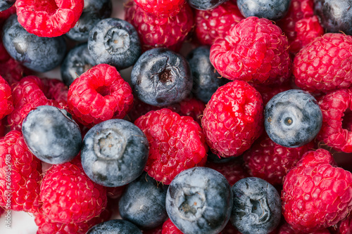 Fresh Summer Berries mix Background with Strawberry, Raspberry, Red currant, Blueberry and Blackberry.