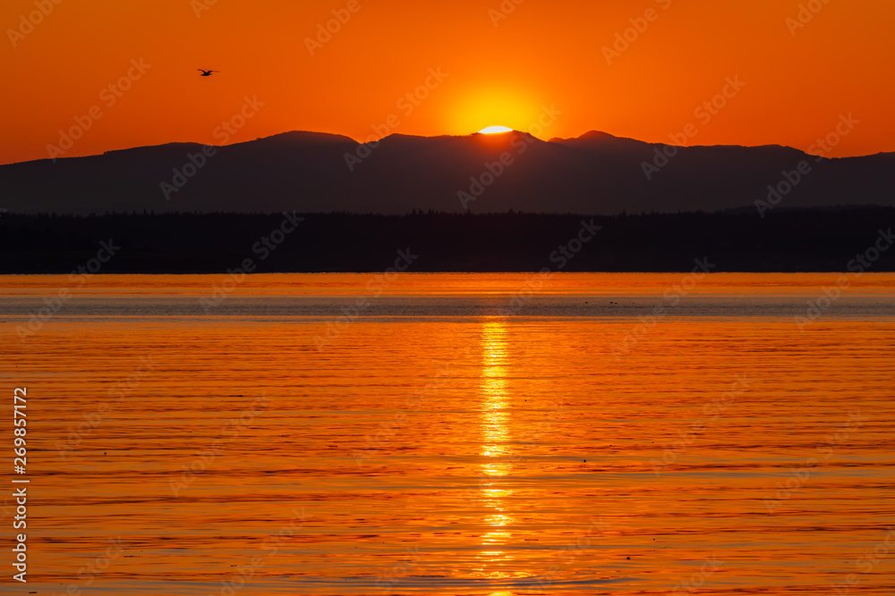 Sunrise over the Cascade Mountains as viewed from Puget Sound from Port Townsend
