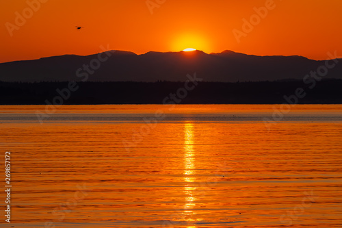 Sunrise over the Cascade Mountains as viewed from Puget Sound from Port Townsend