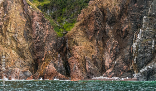 Photographie View of Cape Breton Island from a boat on the water.
