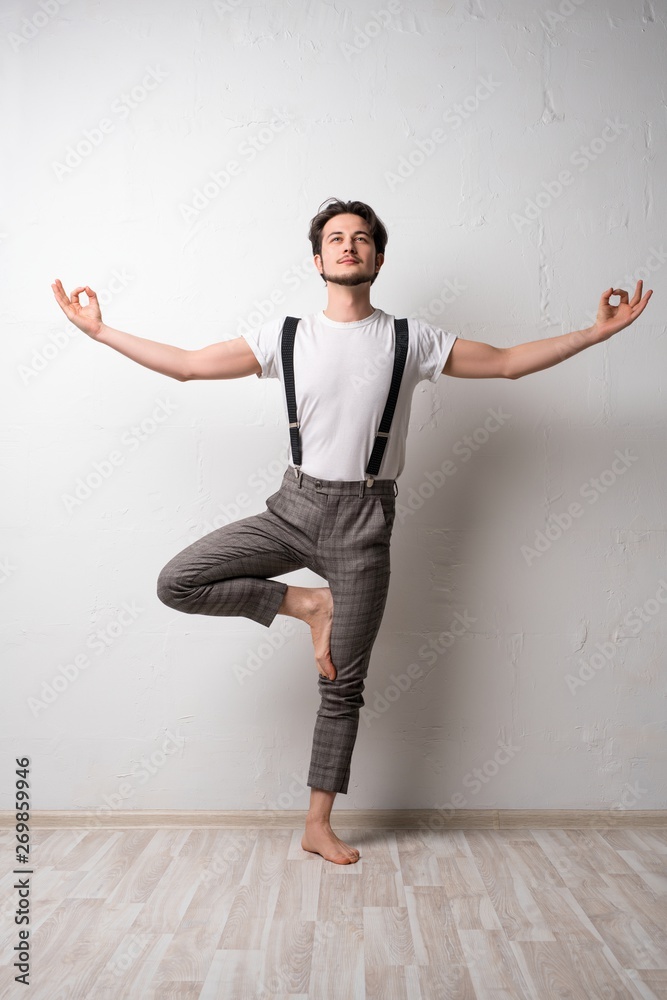 Handsome brunette in yoga pose shot