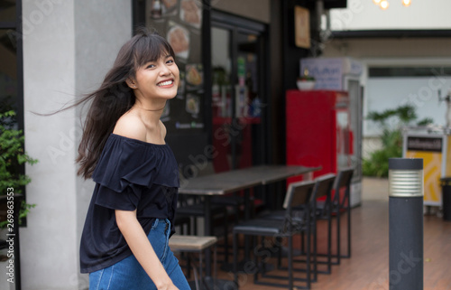  asian woman walking with happy on restaurant background
