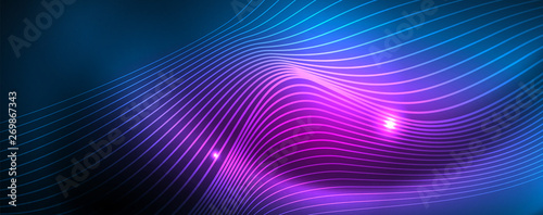 Smooth wave lines on blue neon color light background. Glowing abstract wave on dark, shiny motion, magic space light