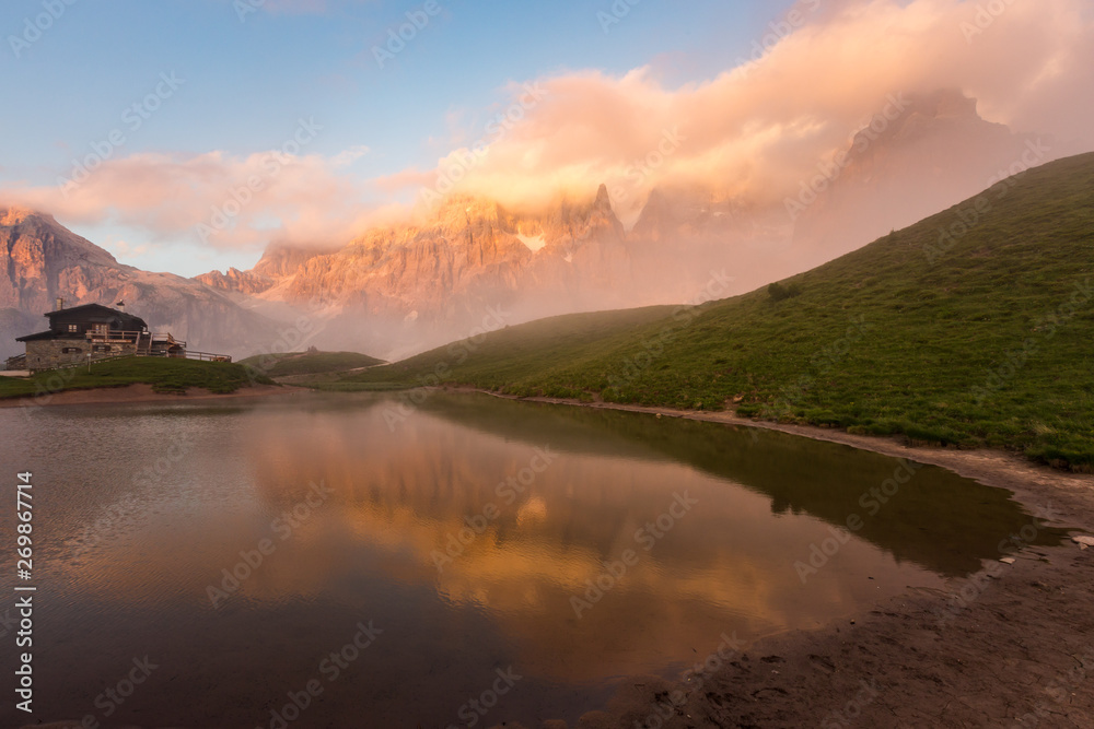 Sunset in Passo Rolle - Baita Segantini lake in Dolomite mountain range, Italy. Sunset in Passo Rolle - Baita Segantini lake in Dolomite mountain range, Italy.