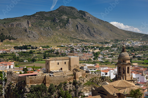 Church of the Incarnation belfry and Moorish Alcazaba fortress under Gorda Peak at Loja Granada Spain