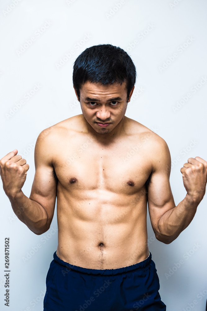 Smart and strong asian muscle man posting on white background Smart and strong asian muscle man posting on white background