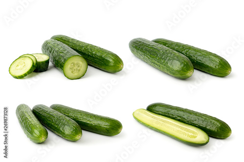 Set of ripe cucumbers on a white background.